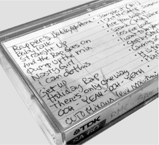 An old cassette tape with a hand-written track list.